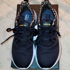 Black Adidas w/leopard accent material